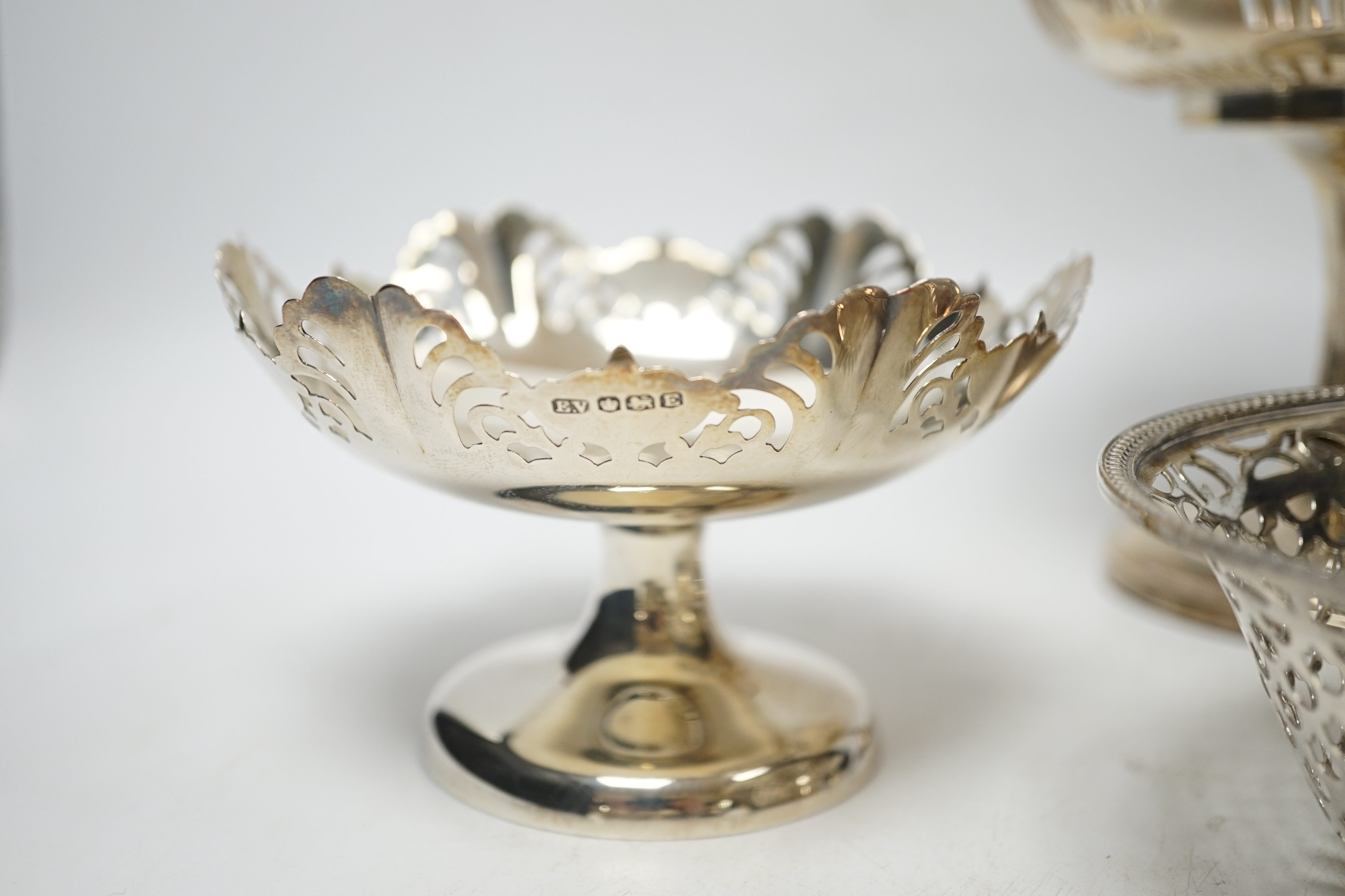 A pair of George VI pierced silver pedestal bon bon dishes, Viners Ltd, Sheffield, 1947, 11.7cm and three other assorted silver bonbon dishes, one with ring handles.